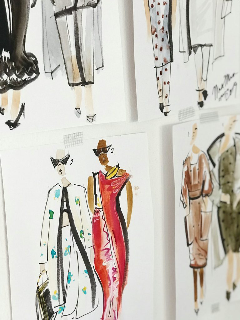 Fashion design illustration sketches on paper